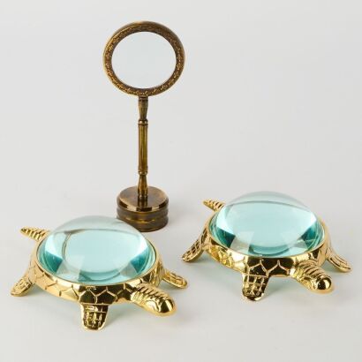 A Trio of Brass Magnifying Glasses