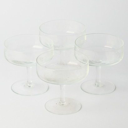 A Set of Four Etched Champagne Coupes