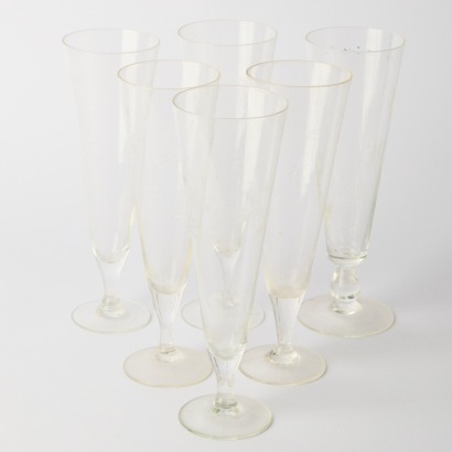 A Set of Six Etched Champagne Glass
