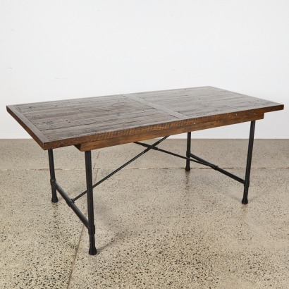 A Hardwood and Iron Dining Table