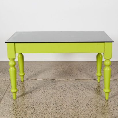 A Vintage Overpainted Table With A Glass Top