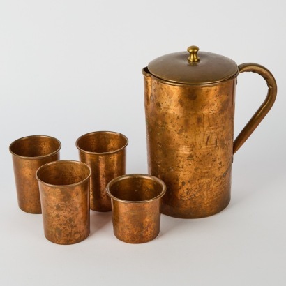 A Vintage Copper Jug with Four Copper Glasses