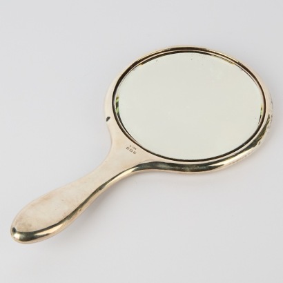 An Antique Sterling Silver And Tortoiseshell Hand Mirror