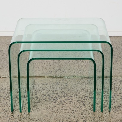 A Set of Three Stacking Glass Waterfall Side Tables
