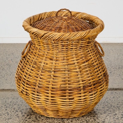 A Vintage Handwoven Wicker Laundry Basket