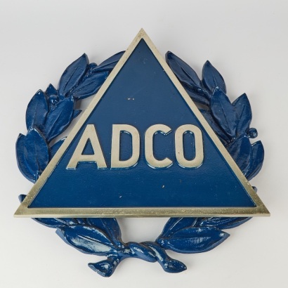 A Metal ADCO Wall Plaque