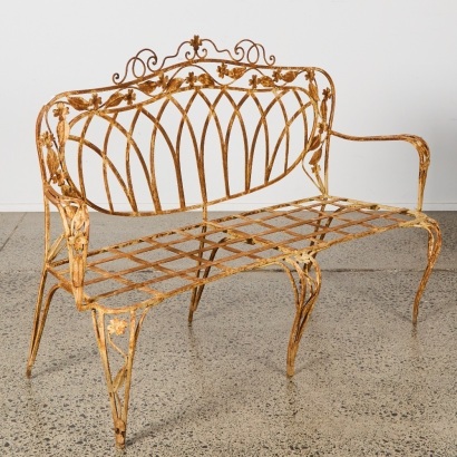 A Vintage French Wrought Iron Two Seater With Floral Motifs
