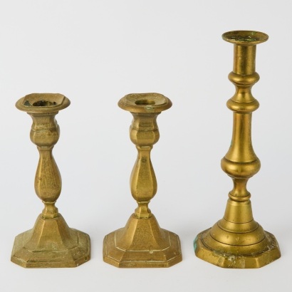 A Set of Three Brass Candle Stick Holders