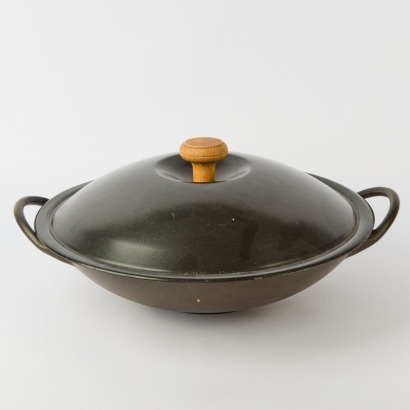 A Cast Iron Lidded Wok With Rack