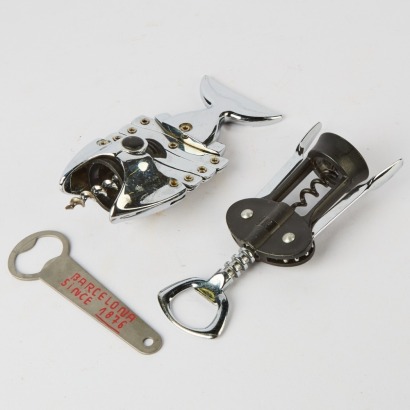 A Collection of Three Bar Tools, A Lazy Fish Corkscrew, A Wmf Corkscrew and an Estrella Bottle Opener