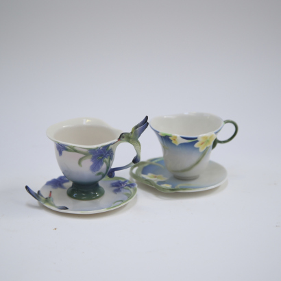 Two Sets of Chinese-Manufactured European-Style 'Floral and Bird' Cup and Saucer