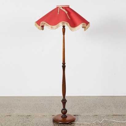 A Standard Lamp With A Large Plastic Shade