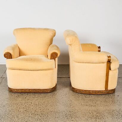 A Pair of Club Chairs with Carved Wood Trim