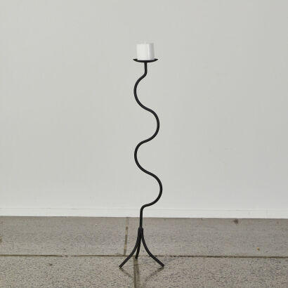 A Tall Wavy Wrought Iron Candle Stick