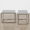 A Pair of Stainless Side Tables With Frosted Glass Tops