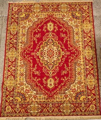 A Large Oriental Floor Rug