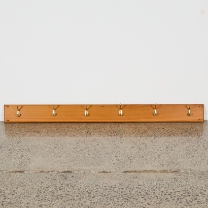 A Rimu Coat With Six Brass Hooks