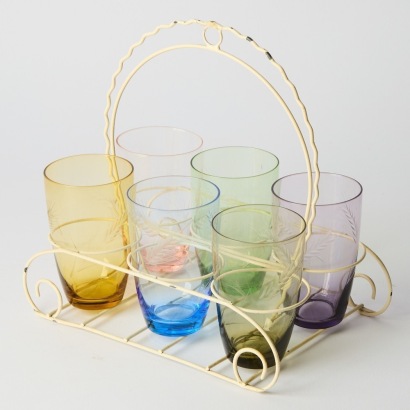 A Set of Six Vintage Multi-Coloured Glasses in a Cream Metal Rack