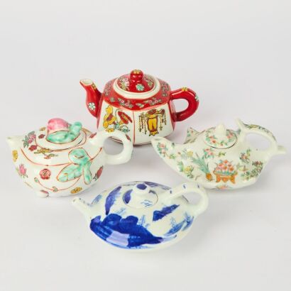 A Set of Four Chinese 20th Century Blue and White and Famille-rose Porcelain Small Teapots