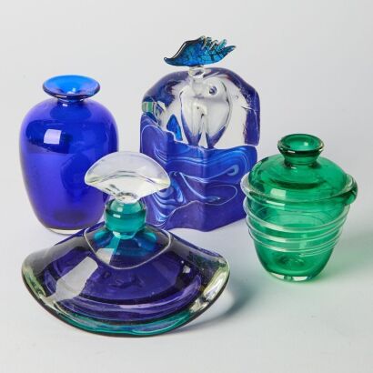 A Set of Four Small Colored Glass Bottles