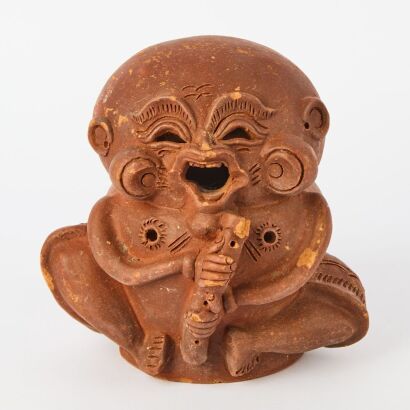 A Chinese Pottery Child-form Candle Holder