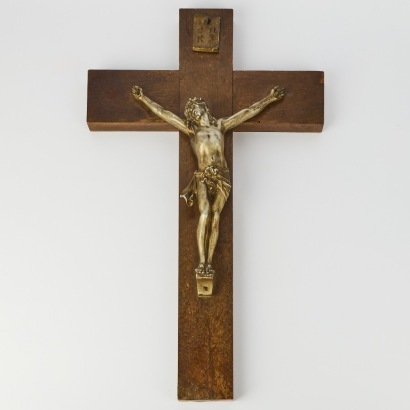 A Metal Cast Christ on a Wood Cross