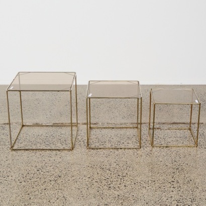 A Set of Three Stacking Glass and Chrome Side Tables