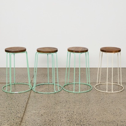 A Suite of Four Metal Bar Stools