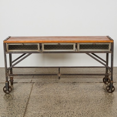 An Industrial Three Drawer Mobile Console