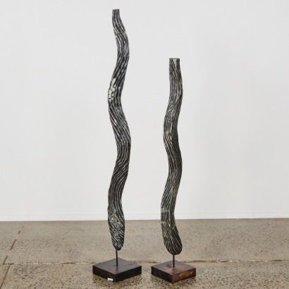A Pair of Hand Carved Wooden Sculptures on Stands
