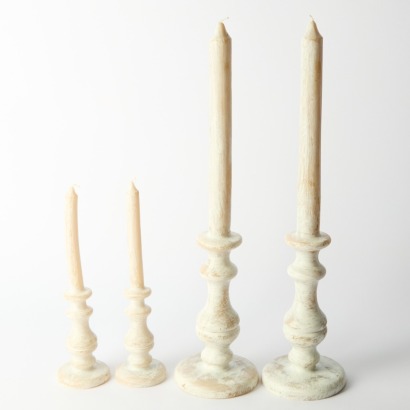 A Set of Four White Wash Pillar Candles