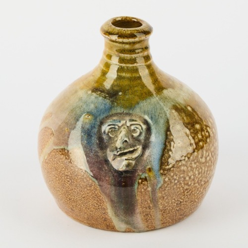 A Mark Goody Carafe with Face Decoration