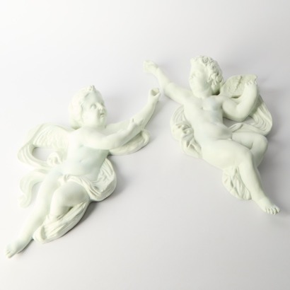 A Pair of Cast Plaster Wall Hung Cherubs