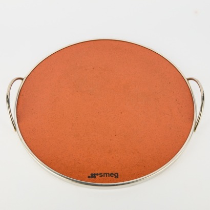 A Smeg Pietra Refractory Pizza Stone With Handles