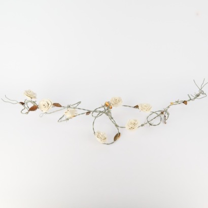 A Barbed Wire And Ceramic Rose Artwork