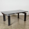 An Italian Style Extendable Dining Table with Smoked Glass Top and Metal and Wood body
