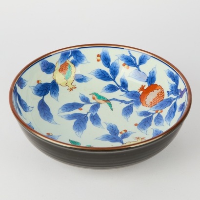 A Handpainted Dish with Flora and Fauna Design