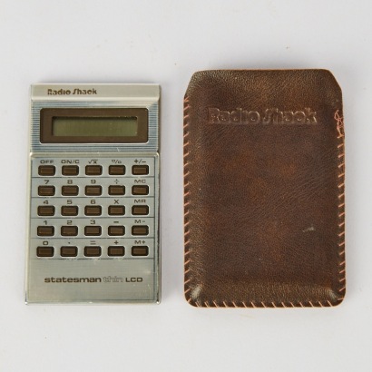 A Vintage Radio Shack Statesman Thin LCD Calculator, c. 1980s