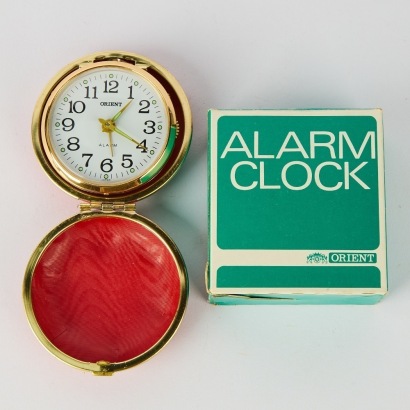 A Vintage Red Orient Japan Travel Alarm Clock