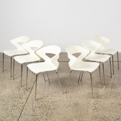 A Set of Six White Plastic Shell Chairs