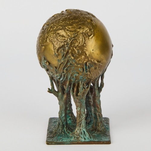 A Bronze Alloy Sculpture of a Globe Resting on Trees