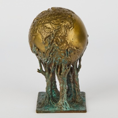 A Bronze Alloy Sculpture of a Globe Resting on Trees