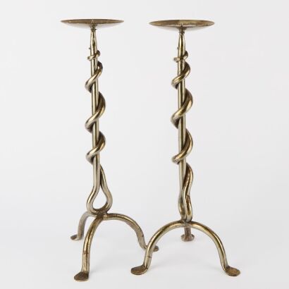 A Pair of Polished Steel Candle Holders
