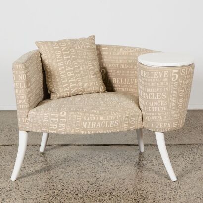 An Arm Chair and Built in Side Table