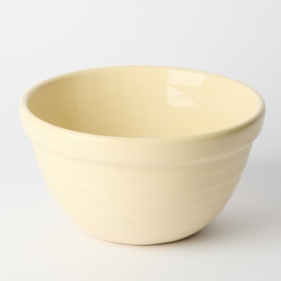 A Large Crown Lynn Mixing Bowl with Tiki Stamp