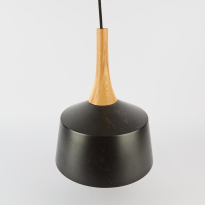 A Black Metal and Wood Pendant