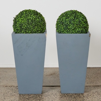A Pair of Modernist Planters with Topiary Balls