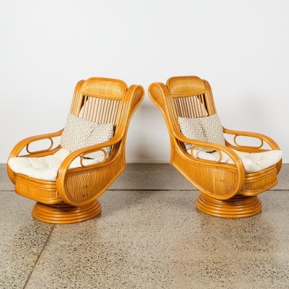 A Pair of Vintage Cane Swivel Chairs