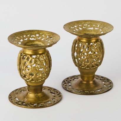 A Pair of Pierced Brass Candle Holders