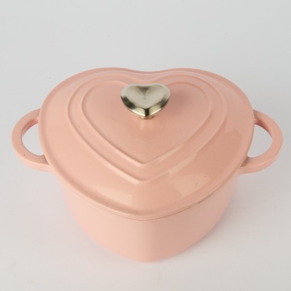 A Pink Heart Shaped Cast Iron Casserolle